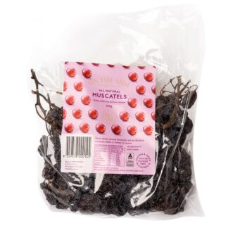 A 300g package of On The Side Muscatels featuring whole premium dried grape clusters on the stem, displayed next to a gourmet cheese board with brie and crackers.